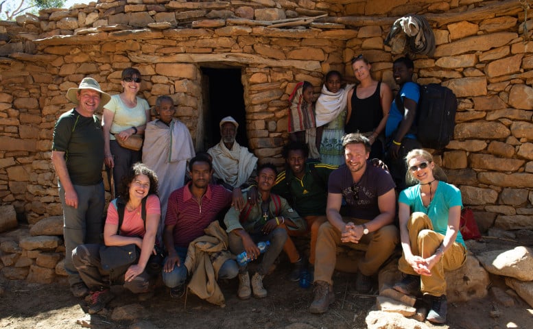 Group outside local villagers hut, Gheralta Mountains, Ethiopia