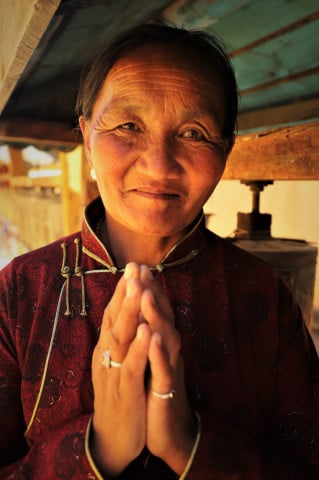 Mongolian Woman with Prayer Wheel