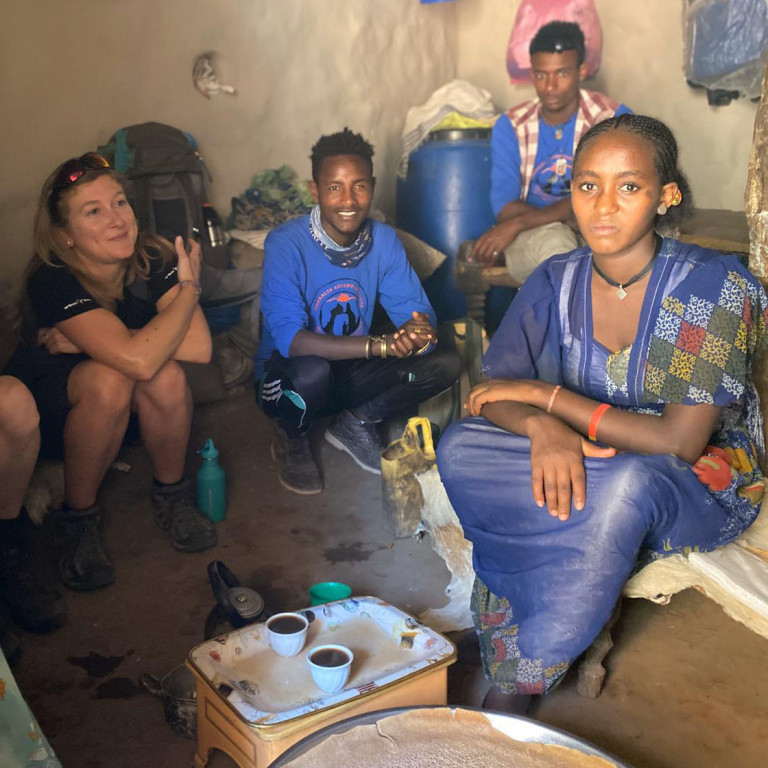 Sharing coffee with locals inside Ethiopian Hut, Gheralta, Ethiopia