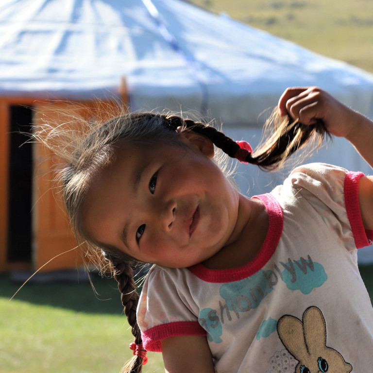 Young girl with pigtails, Host Family, Mongolia