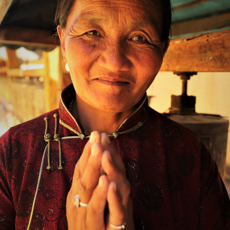 Mongolian Woman with Prayer Wheel